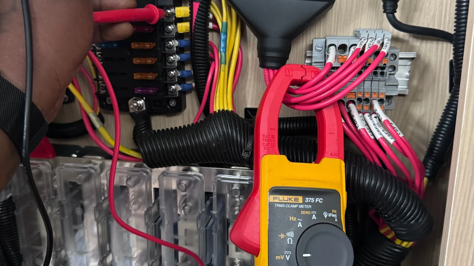 Illustrative image of marine electrical technicians working aboard a yacht